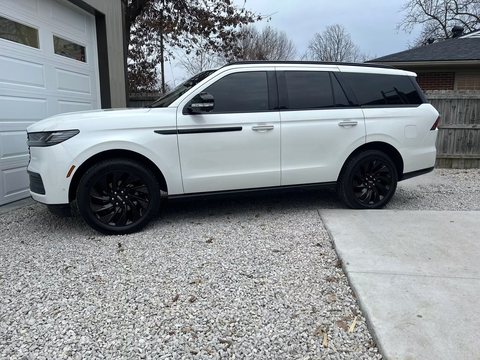 White luxury SUV with tinted windows