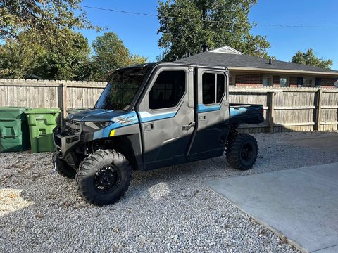 Side-by-side UTV with tinted cab glass