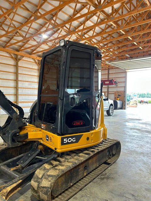 The same excavator cab after tinting, glass now dark