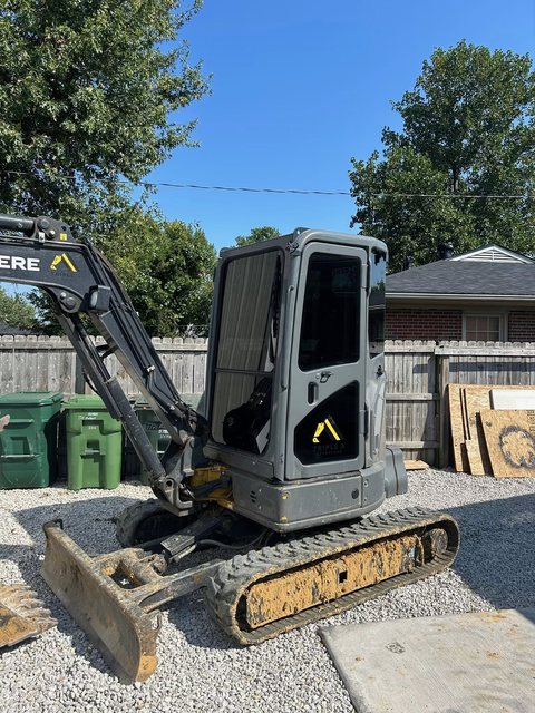 The same excavator cab after tinting, glass now dark