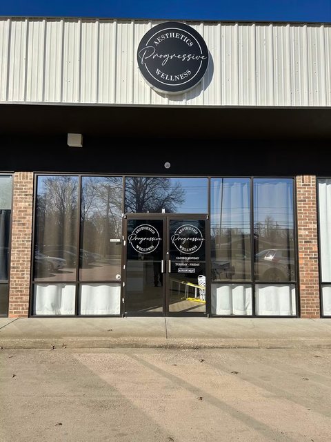 Storefront with tinted glass and glass entry doors